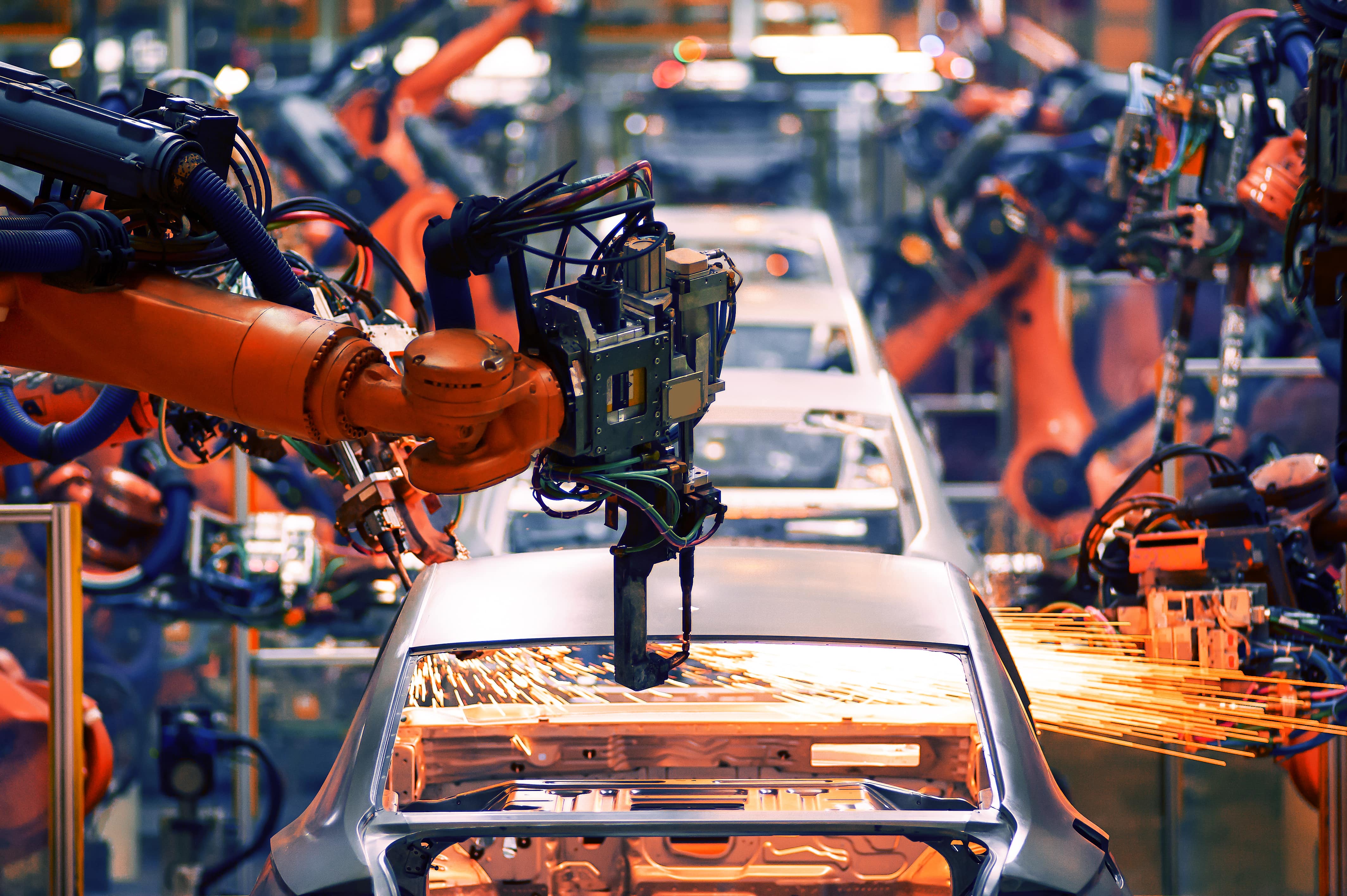 Cars being assembled on a production line