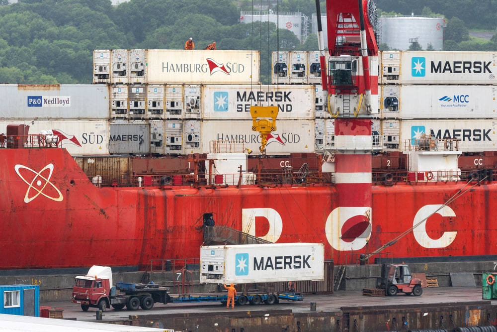 Maersk cargo container being loaded onto a ship at Kamchatka, Russian